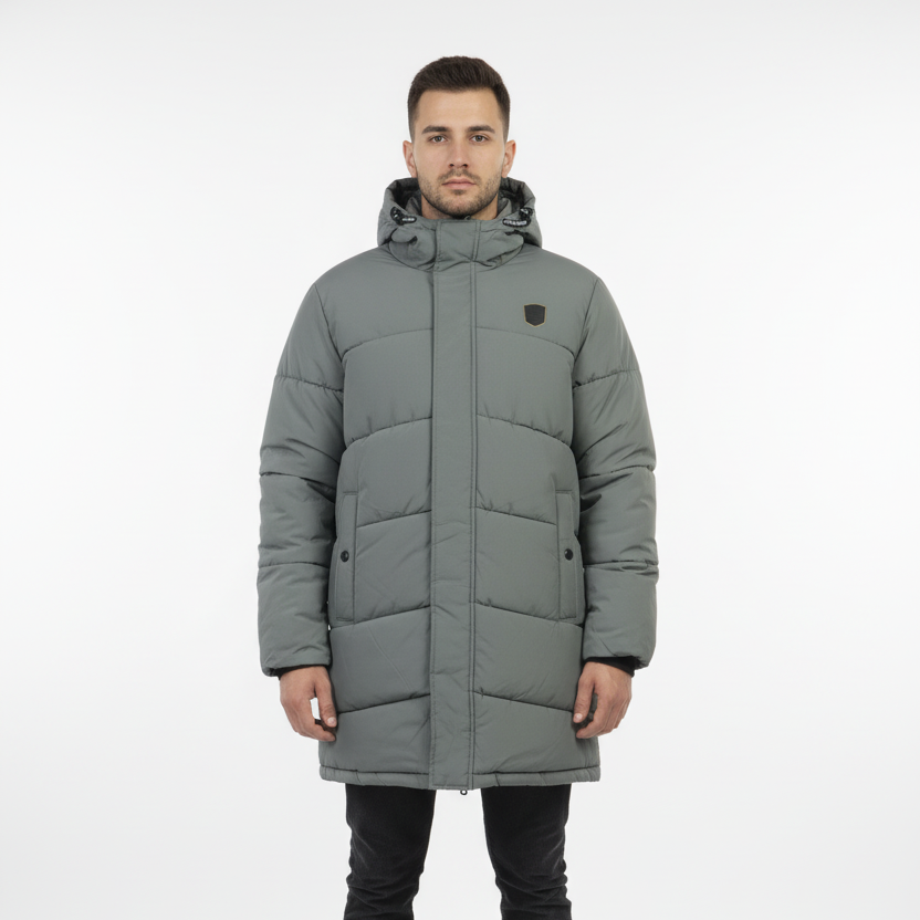 Man wearing a gray puffer coat on a white background